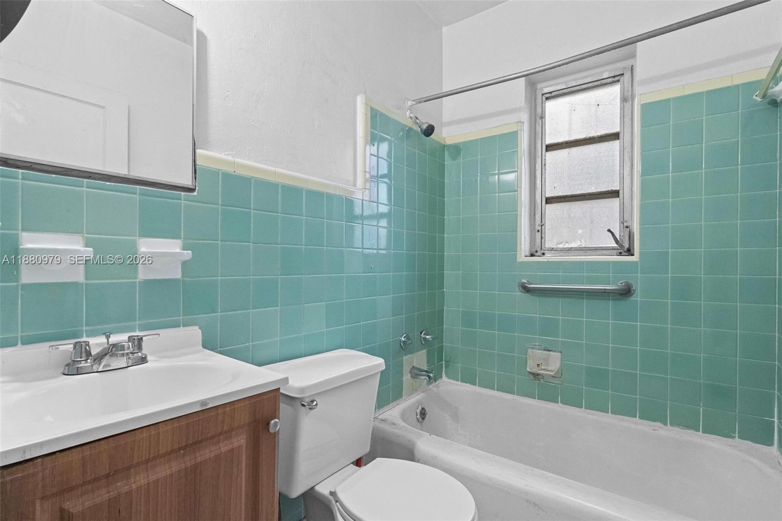 1345 Southwest 7th Street Miami, FL 33135 - Photo 15 of 37 a bathroom with a sink toilet and shower