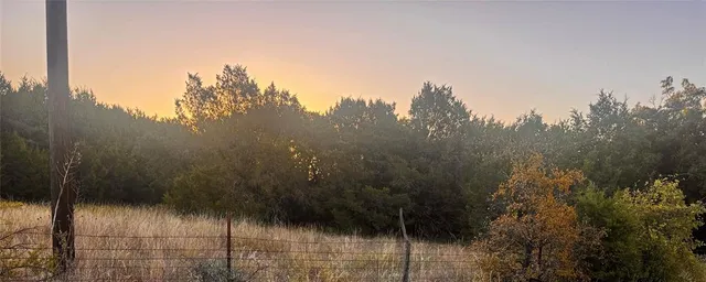 a view of a yard and mountain view