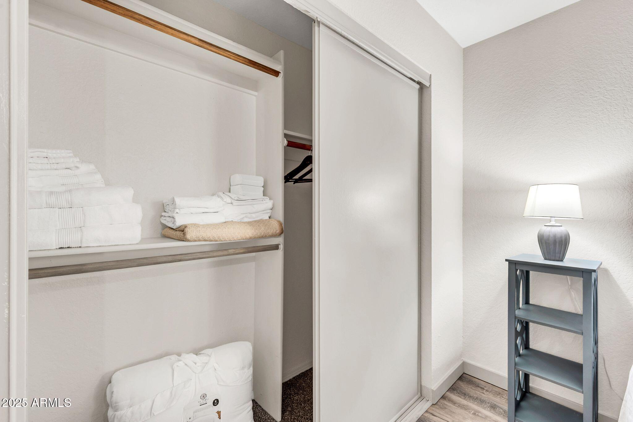 8787 East Mountain View Road, Unit 2100 Scottsdale, AZ 85258 - Photo 28 of 47 a bathroom with a sink a light fixture and a toilet