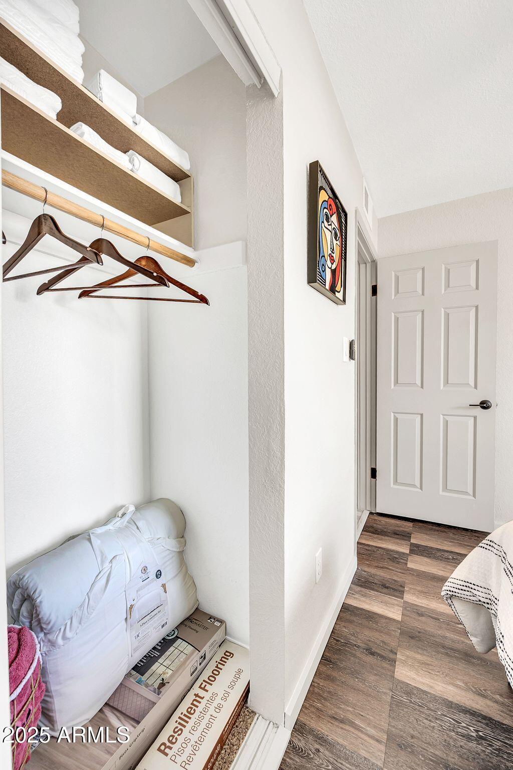 8787 East Mountain View Road, Unit 2100 Scottsdale, AZ 85258 - Photo 38 of 47 a view of a hallway with wooden floor and closet