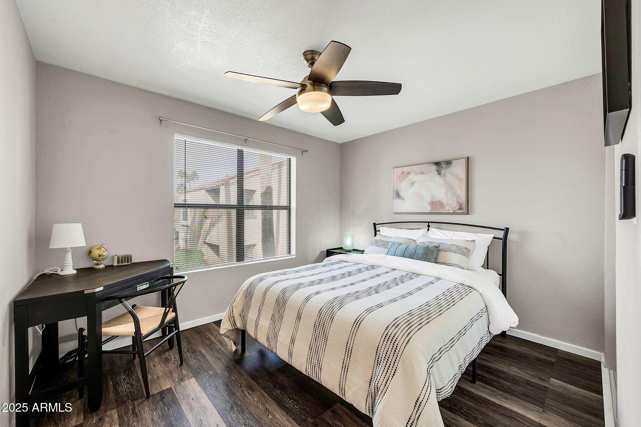 8787 East Mountain View Road, Unit 2100 Scottsdale, AZ 85258 - Photo 39 of 47 a bedroom with a bed and a window