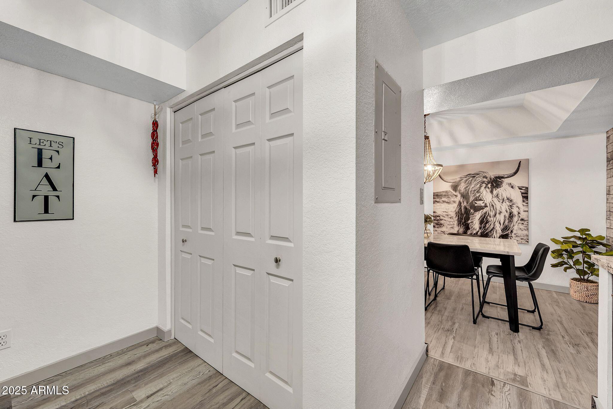 8787 East Mountain View Road, Unit 2100 Scottsdale, AZ 85258 - Photo 43 of 47 a view of a bedroom with furniture and wooden floor