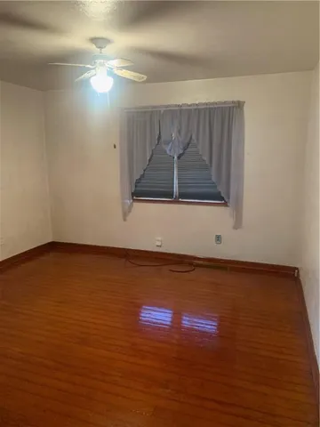 a bedroom with a bed and a mirror