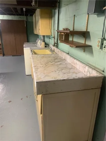 a view of a livingroom with furniture and a flat screen tv