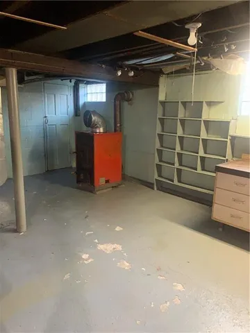 a living room with furniture a rug and a window