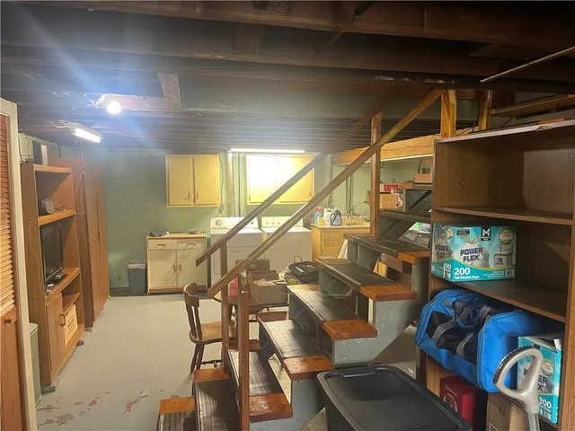 a dining room with furniture and a chandelier