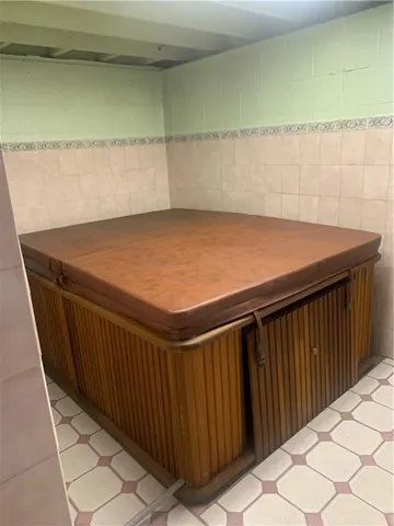 a green field with trees in the background