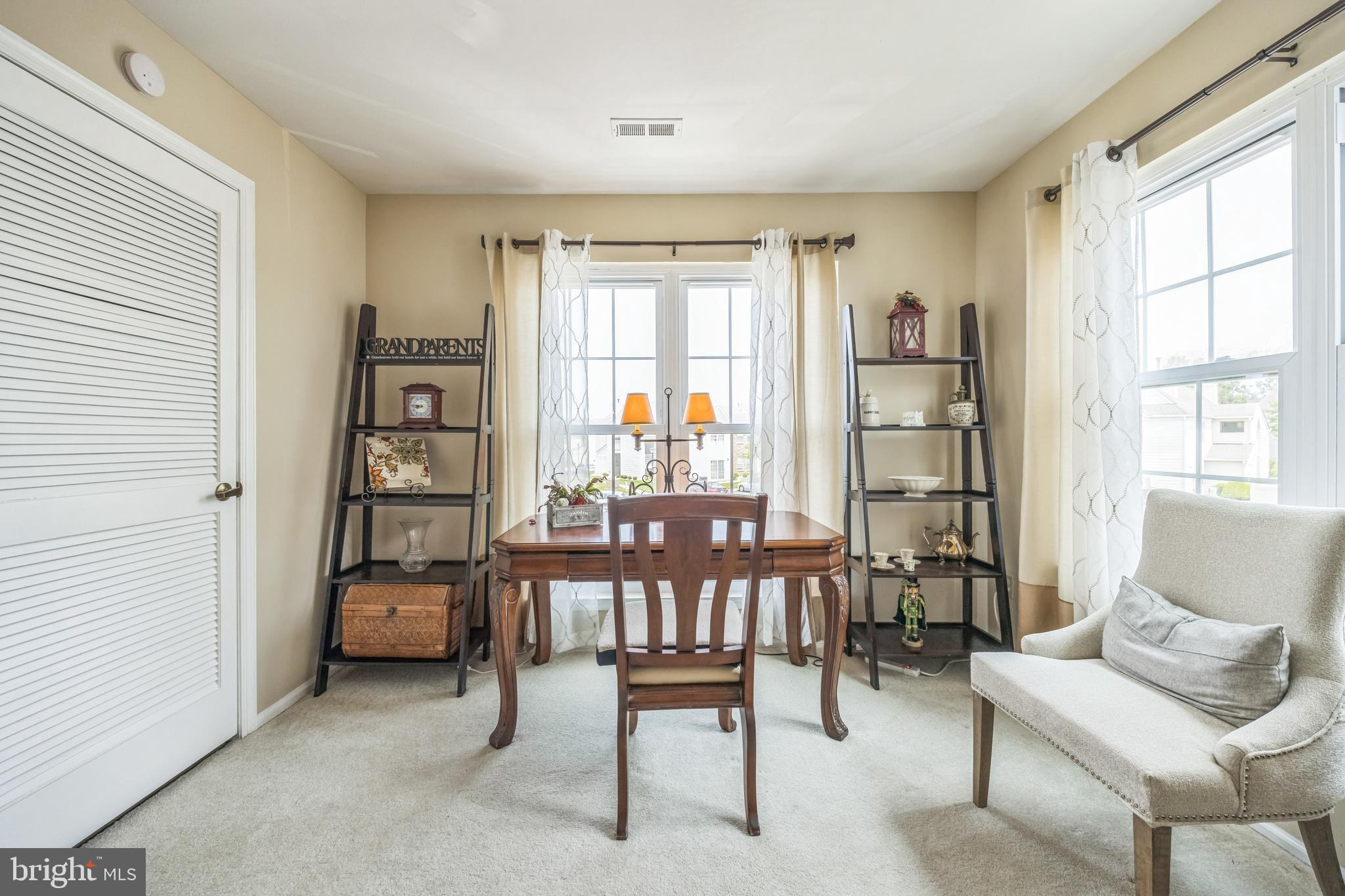 402 B Violet Drive Mount Laurel, NJ 08054 - Photo 11 of 35 a view of a livingroom with furniture and window