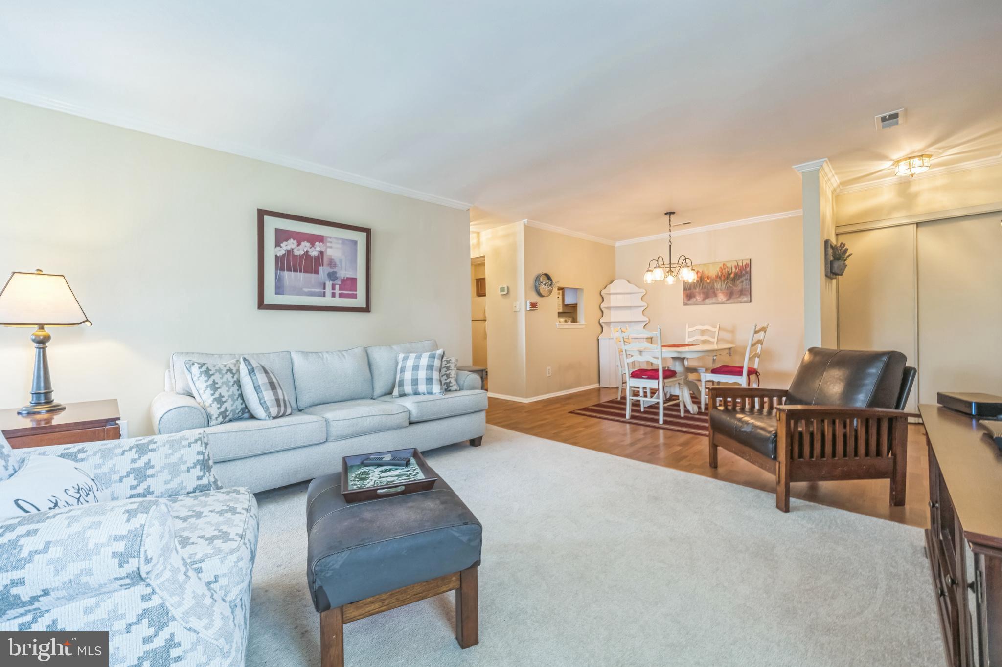 402 B Violet Drive Mount Laurel, NJ 08054 - Photo 13 of 35 a living room with furniture and a flat screen tv