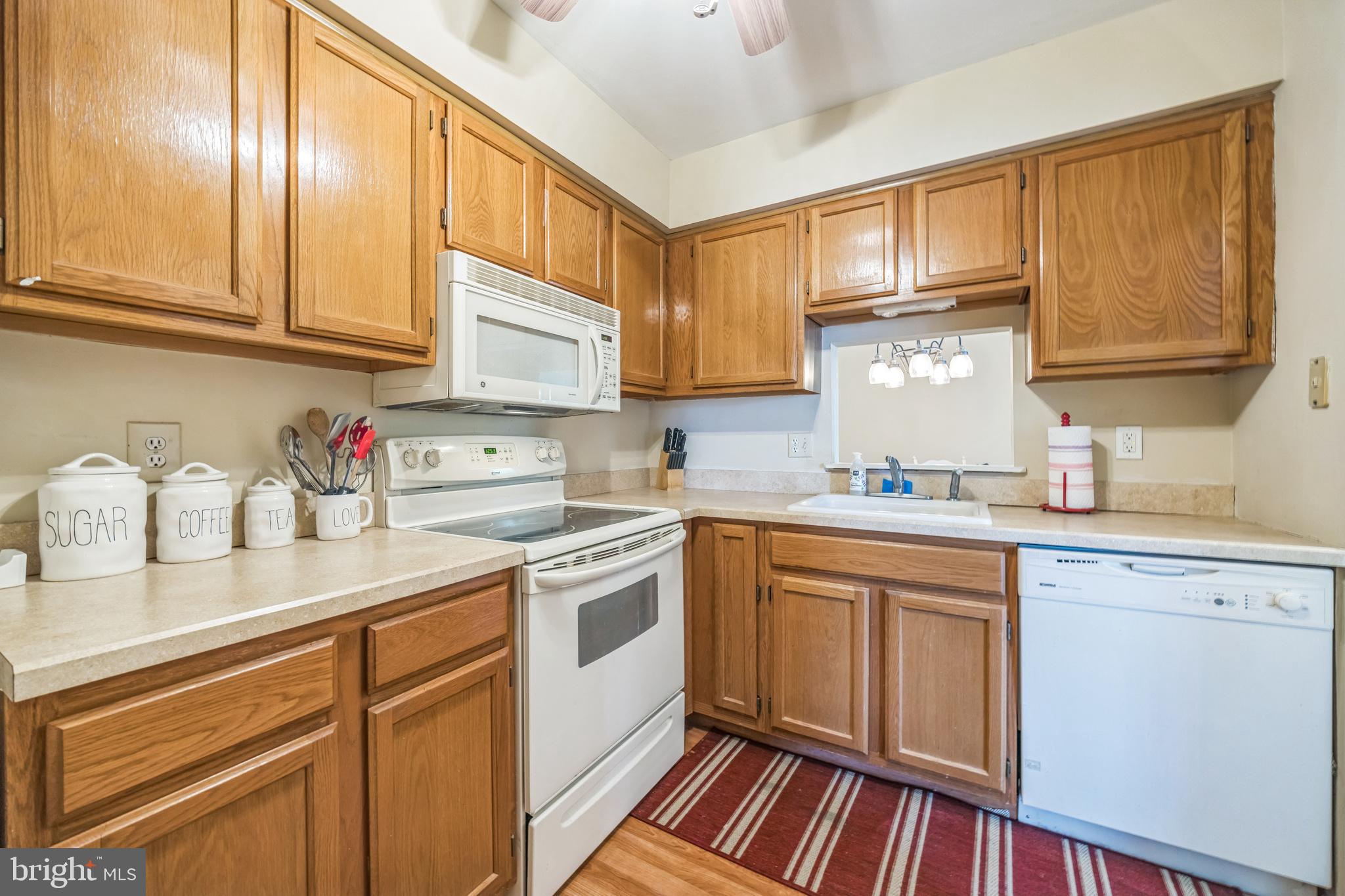 402 B Violet Drive Mount Laurel, NJ 08054 - Photo 19 of 35 a kitchen with stainless steel appliances granite countertop a sink and cabinets