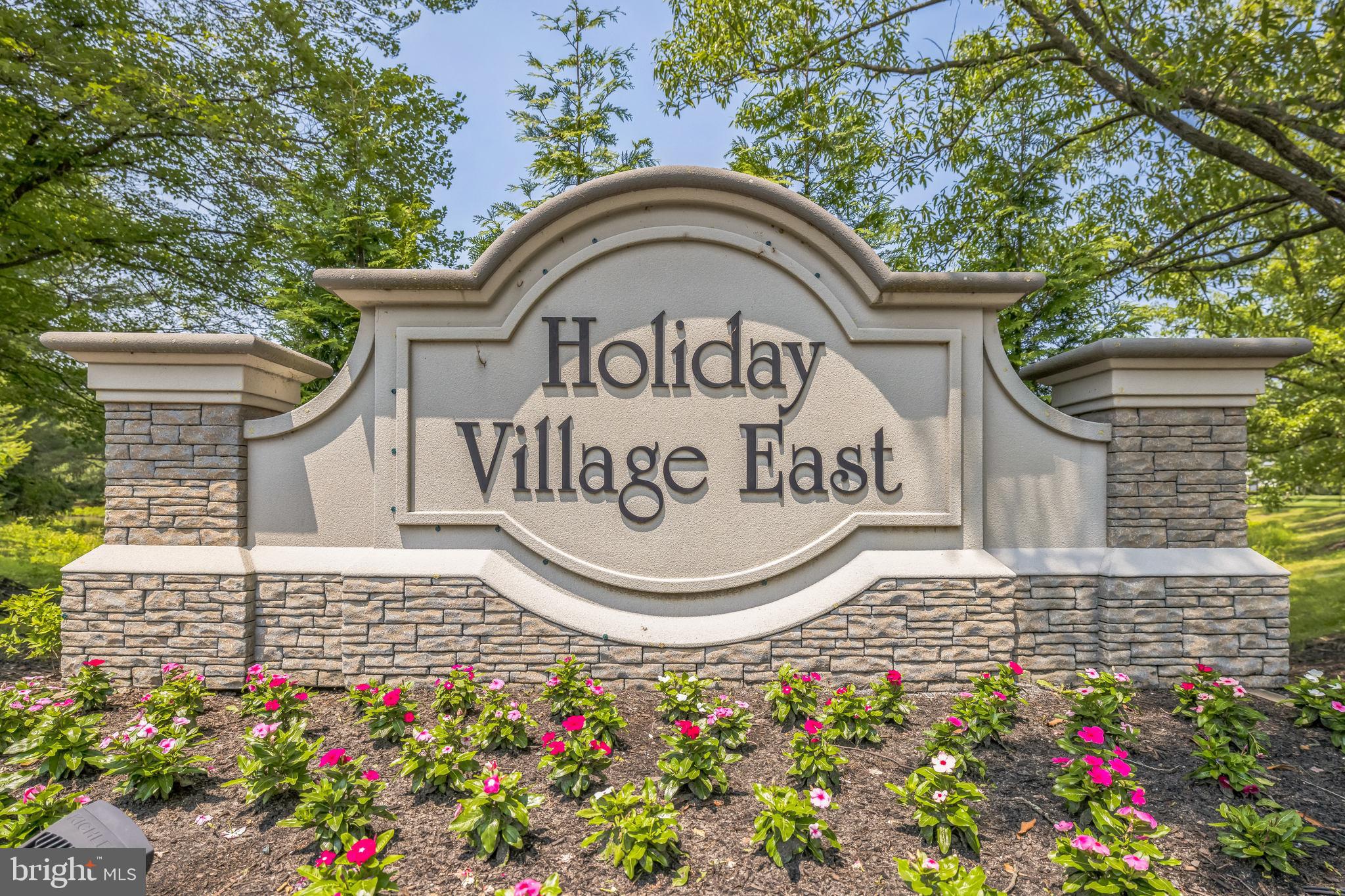 402 B Violet Drive Mount Laurel, NJ 08054 - Photo 2 of 35 a view of outdoor space with signage and flags