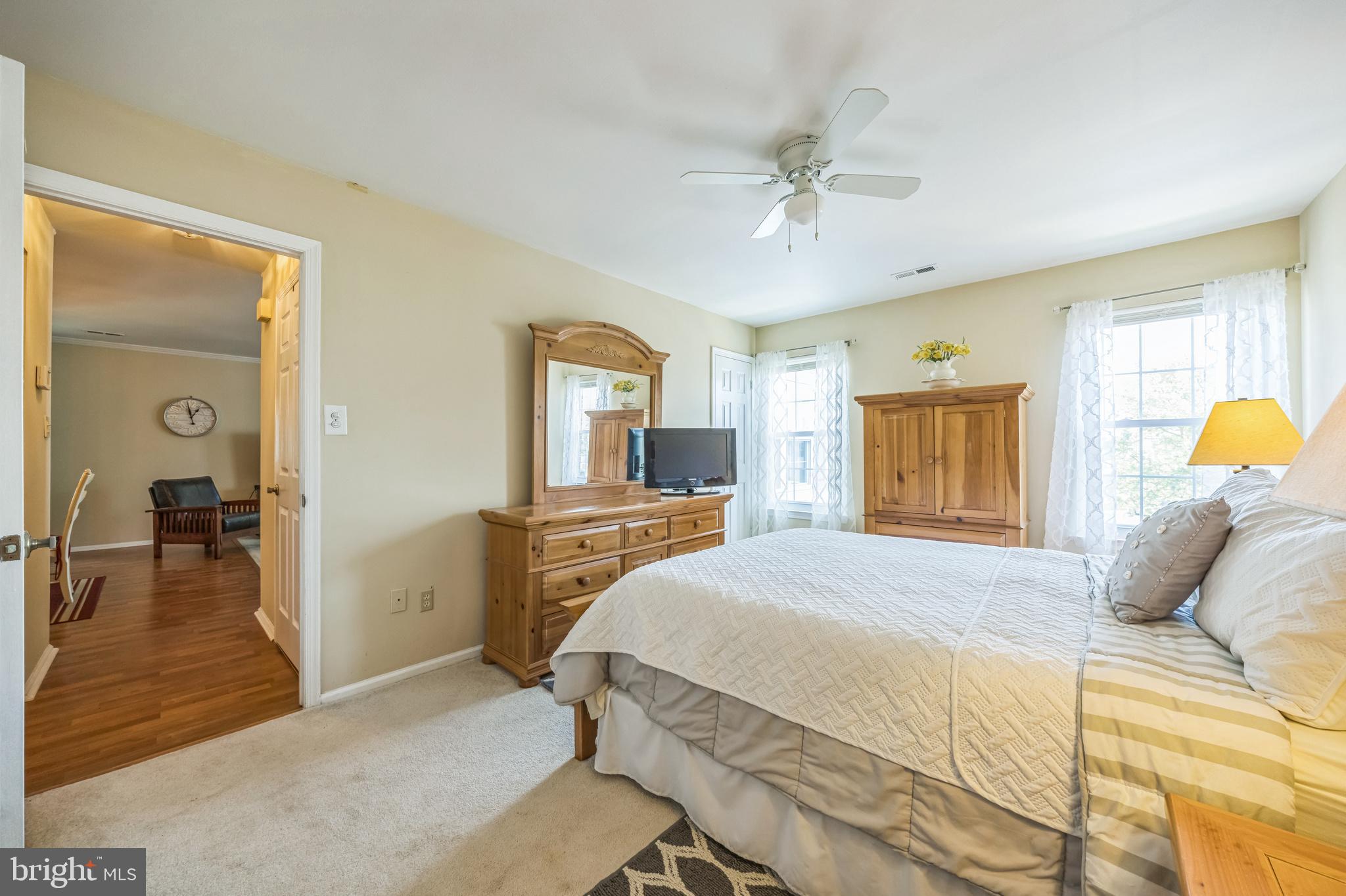 402 B Violet Drive Mount Laurel, NJ 08054 - Photo 25 of 35 a bedroom with a bed and a chandelier