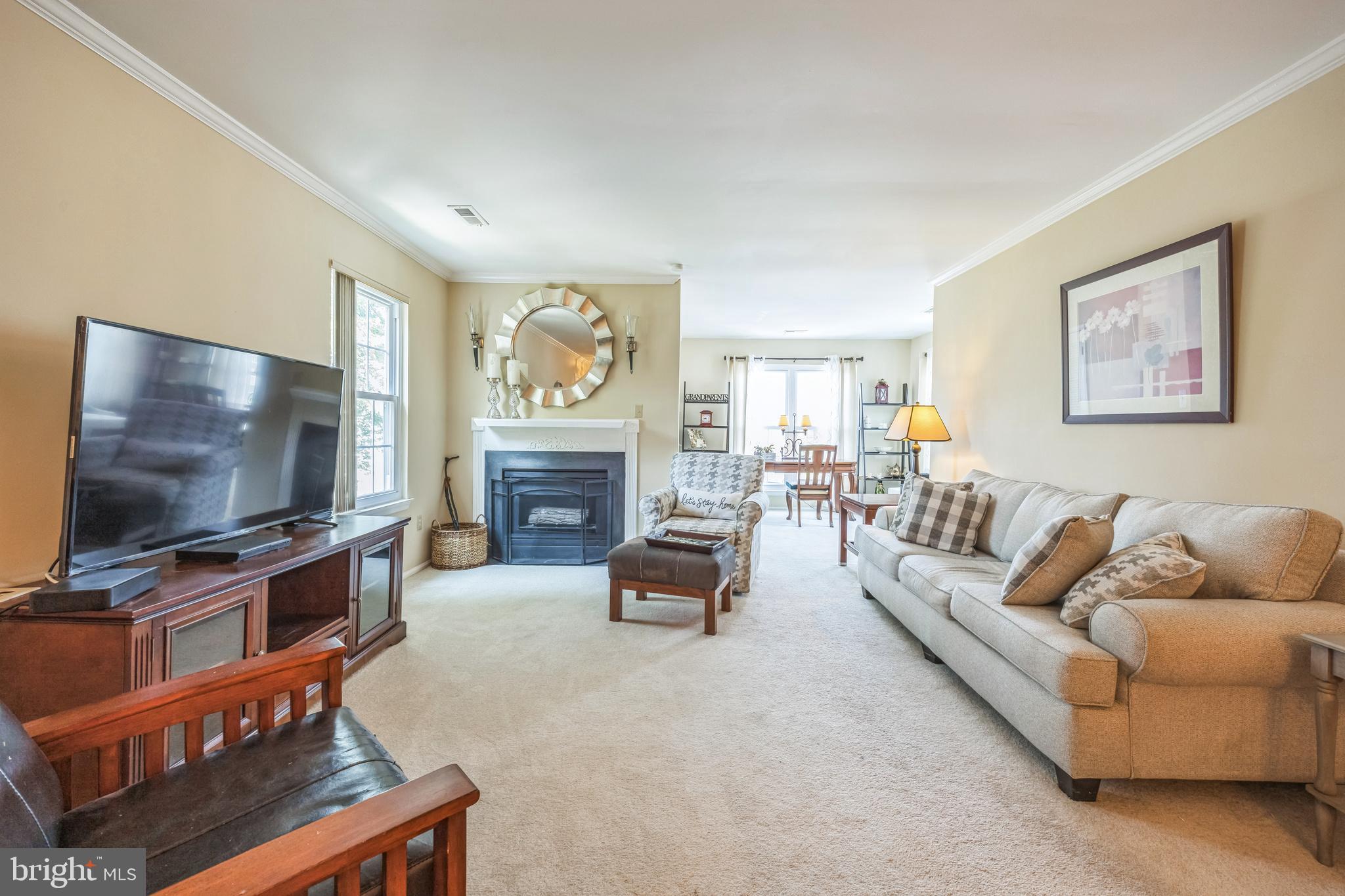402 B Violet Drive Mount Laurel, NJ 08054 - Photo 5 of 35 a living room with furniture and a flat screen tv