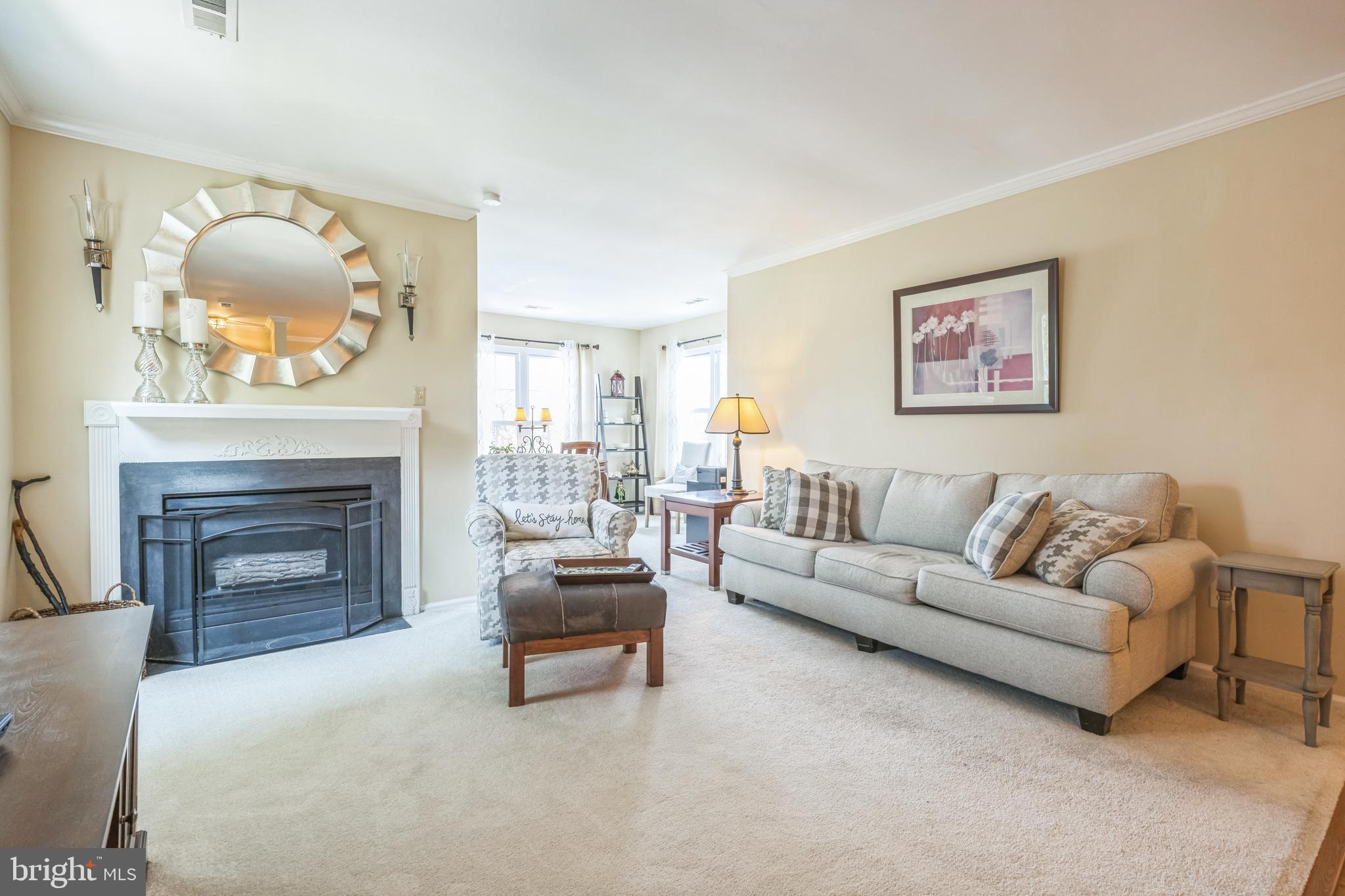 402 B Violet Drive Mount Laurel, NJ 08054 - Photo 6 of 35 a living room with furniture a fireplace and a large mirror