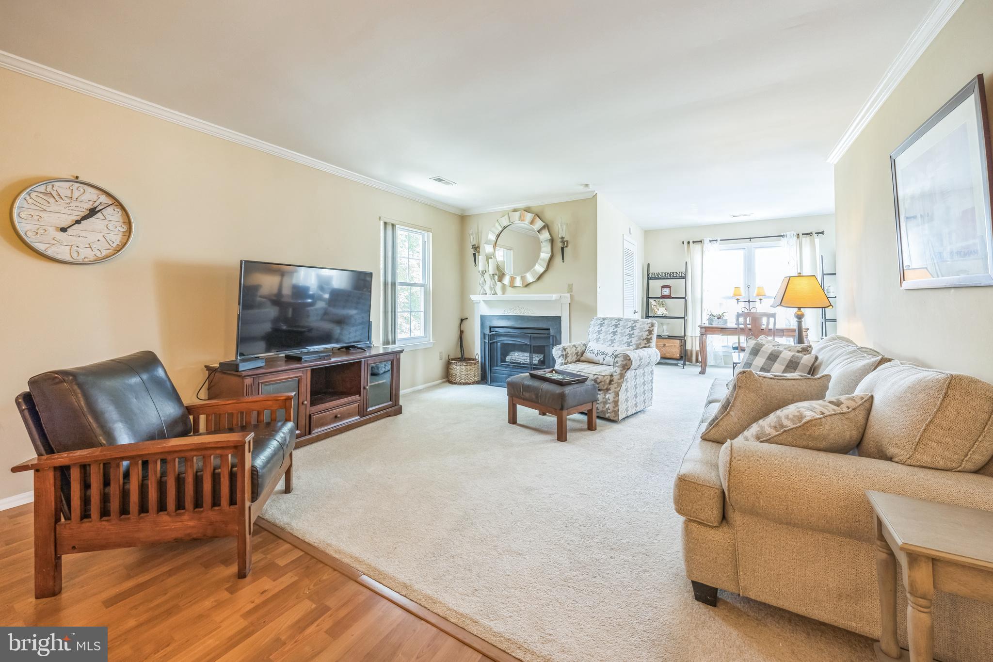 402 B Violet Drive Mount Laurel, NJ 08054 - Photo 7 of 35 a living room with furniture and a flat screen tv