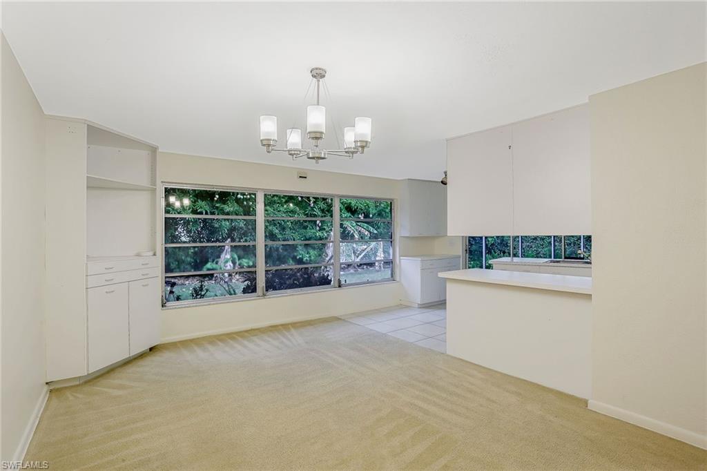 3888 Crayton Road Naples, FL 34103 - Photo 12 of 29 a view of an empty room with a window