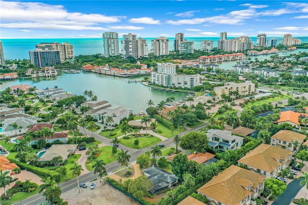 3888 Crayton Road Naples, FL 34103 - Photo 21 of 29 a view of a city with lots of buildings in the background