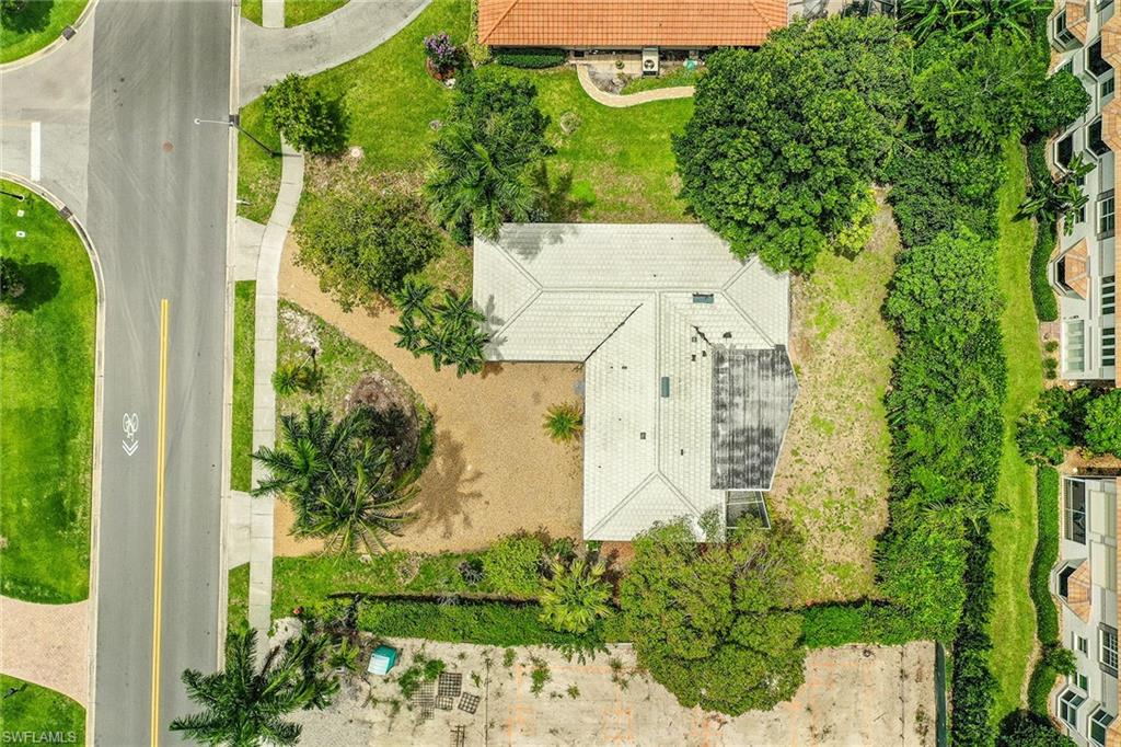 3888 Crayton Road Naples, FL 34103 - Photo 25 of 29 an aerial view of a residential houses with yard