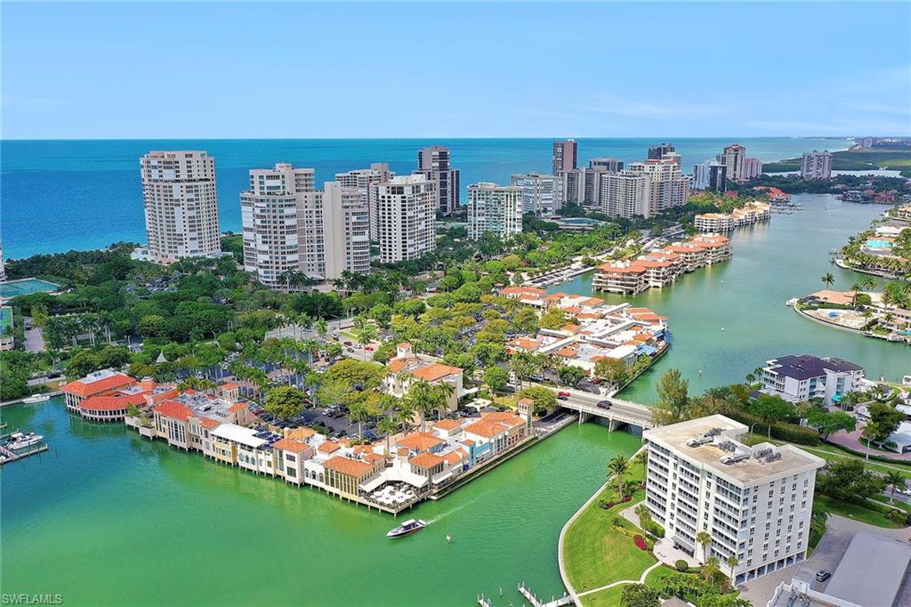 3888 Crayton Road Naples, FL 34103 - Photo 3 of 29 a view of a city with tall buildings