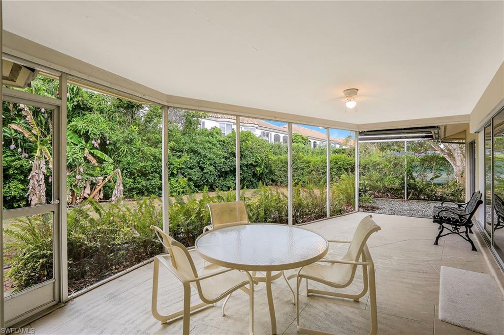 3888 Crayton Road Naples, FL 34103 - Photo 7 of 29 a view of a dining room with furniture window and outside view