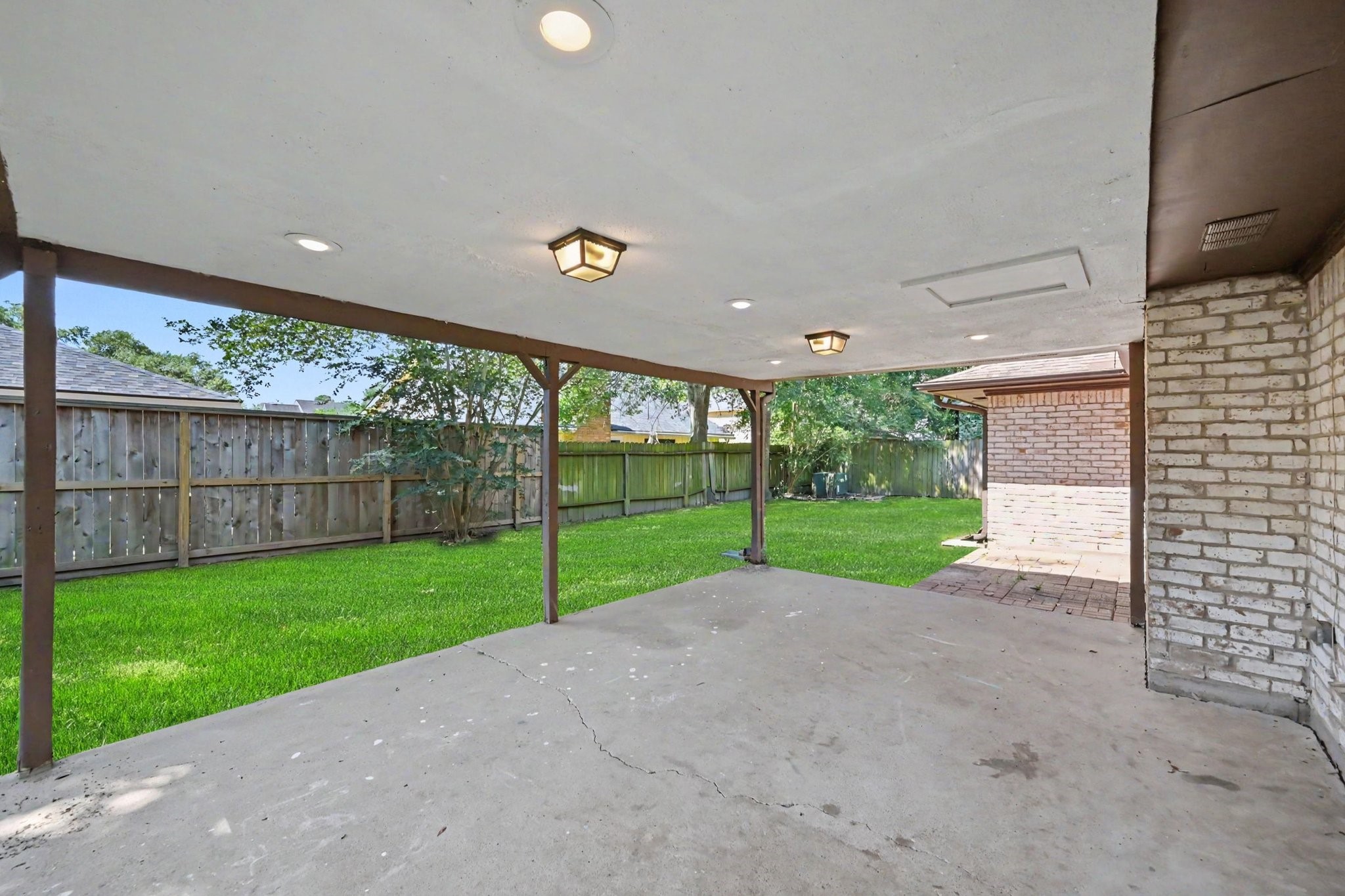 17419 Cassina Drive Spring, TX 77388 - Photo 31 of 35 a view of a yard with porch and wooden fence