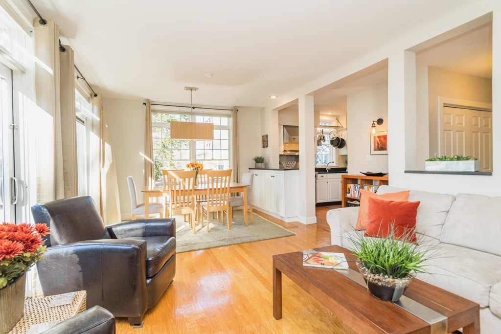 164 Elm Street, Unit 2 Cambridge, MA 02140 - Photo 1 of 26 a living room with furniture and large windows