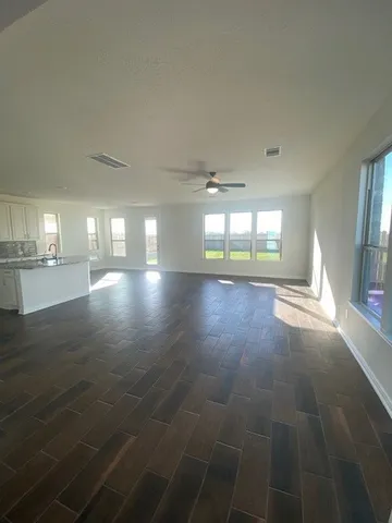 a view of a kitchen with a sink and cabinets