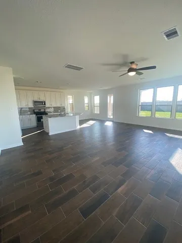 a large white kitchen with lots of counter space
