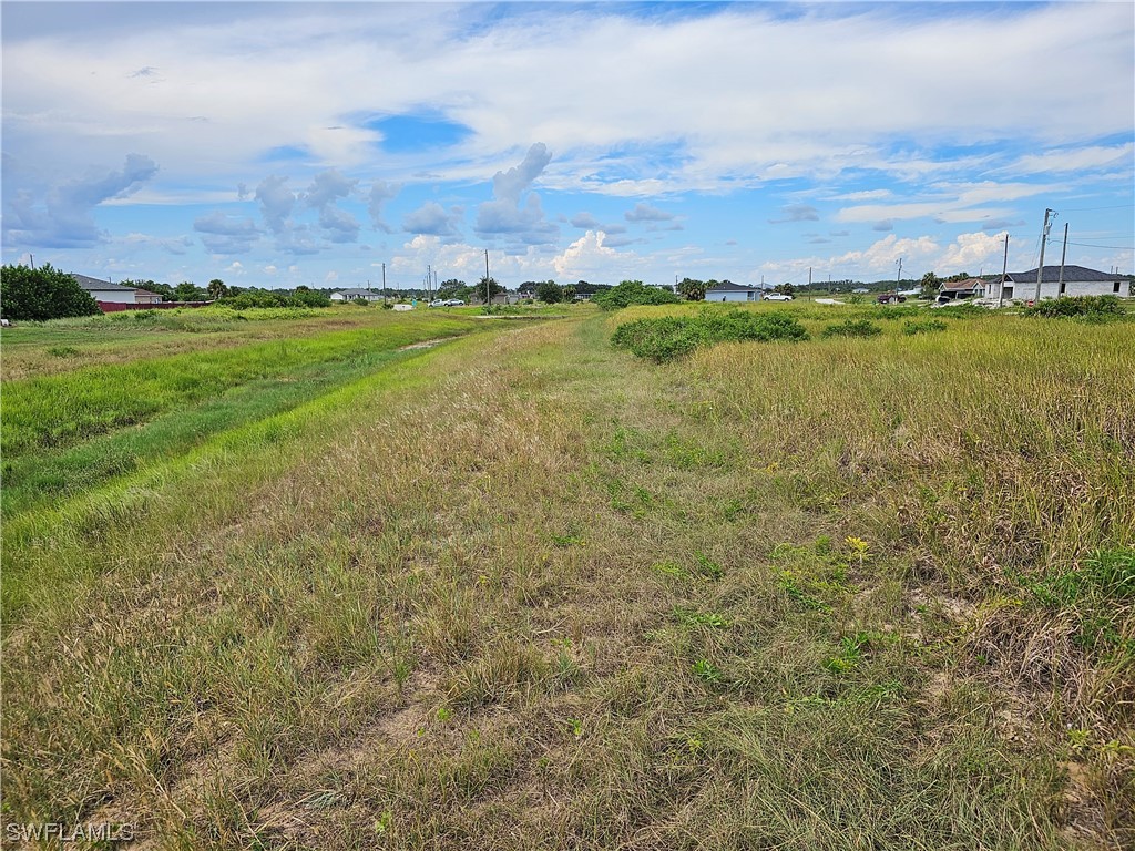 Undisclosed Address LaBelle, FL 33935 - Photo 13 of 14 a view of a lake with a building in the background