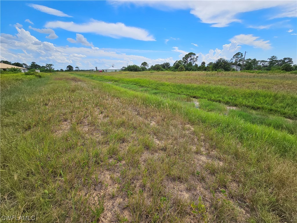Undisclosed Address LaBelle, FL 33935 - Photo 14 of 14 a view of a lake with houses in the background