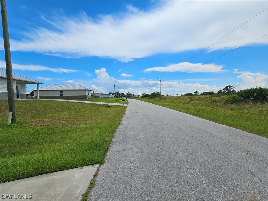 Undisclosed Address LaBelle, FL 33935 - Photo 3 of 14 a view of a lake with a big yard