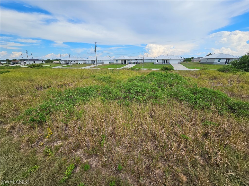 Undisclosed Address LaBelle, FL 33935 - Photo 8 of 14 a view of a garden with an ocean and trees in the background