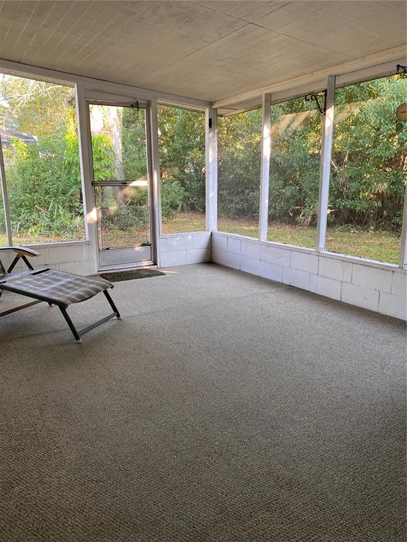 5047 Ferncrest Drive Winter Park, FL 32792 - Photo 23 of 34 a view of a room with gym equipment and large windows