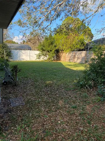 a backyard of a house with lots of green space
