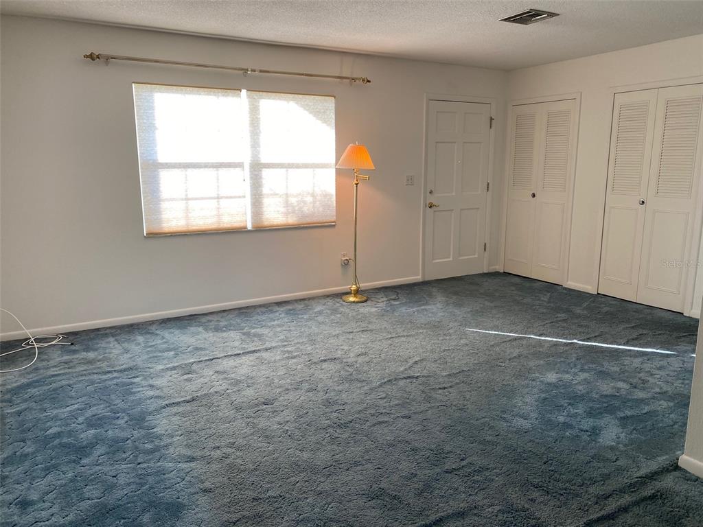 5047 Ferncrest Drive Winter Park, FL 32792 - Photo 5 of 34 a view of an empty room with a window