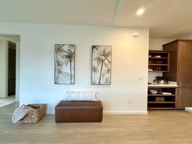 a kitchen with a sink cabinets and a window