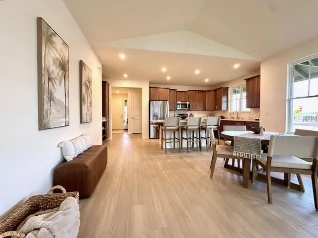 a view of a dining room with furniture window and outside view