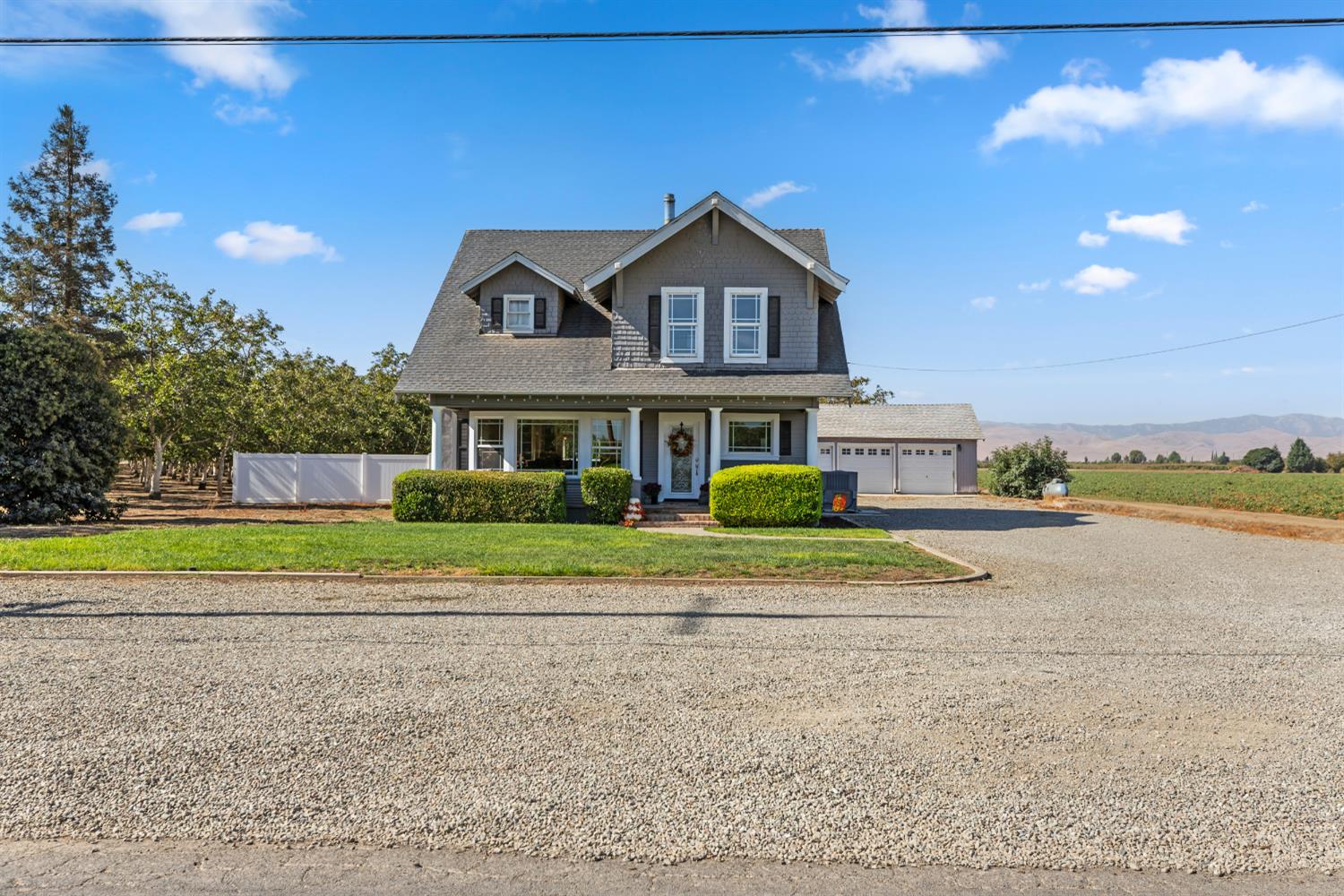 12407 Elm Avenue Patterson, CA 95363 - Photo 1 of 43 a house with swimming pool in front of it