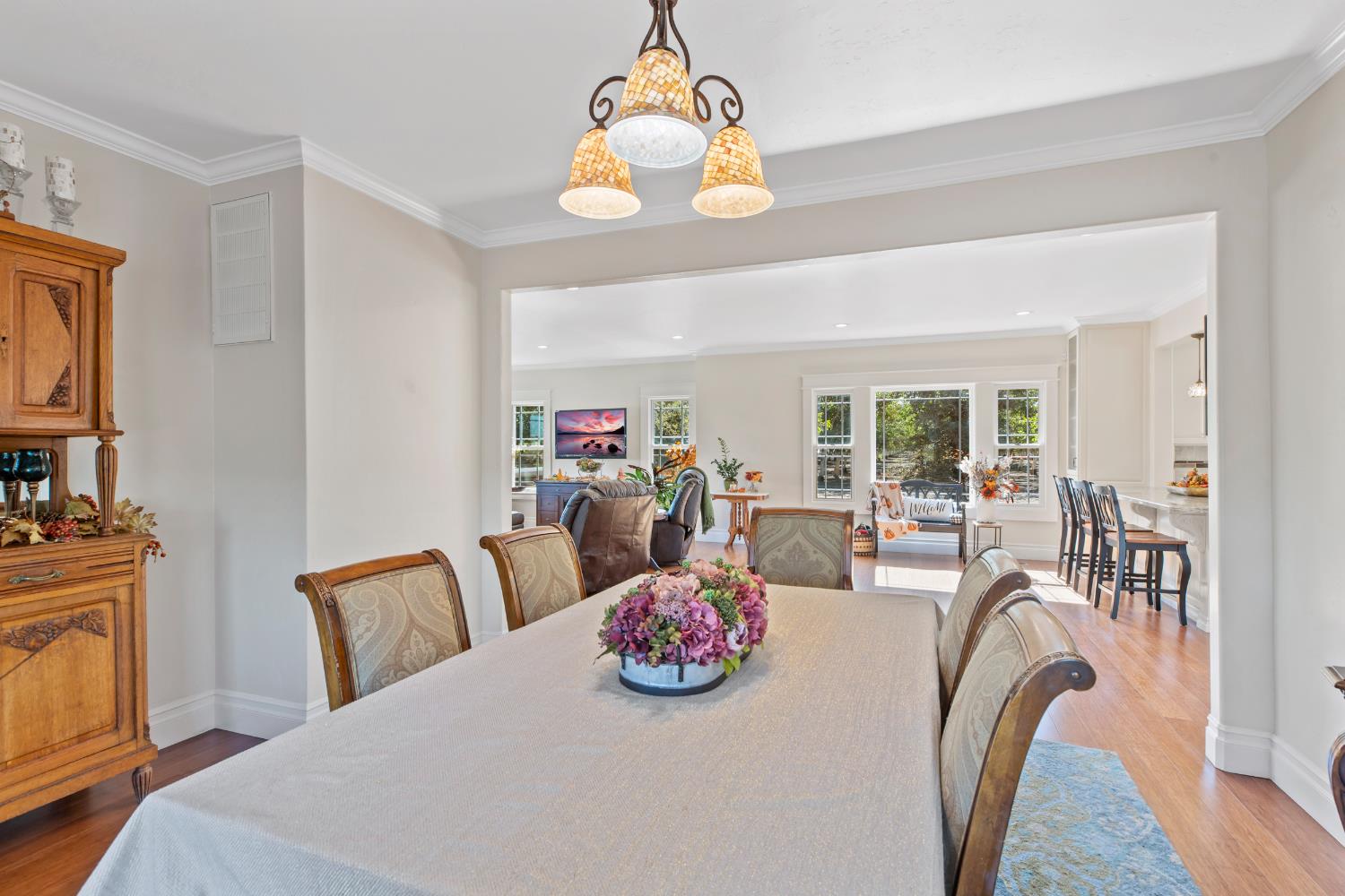 12407 Elm Avenue Patterson, CA 95363 - Photo 16 of 43 a bedroom with furniture and a chandelier