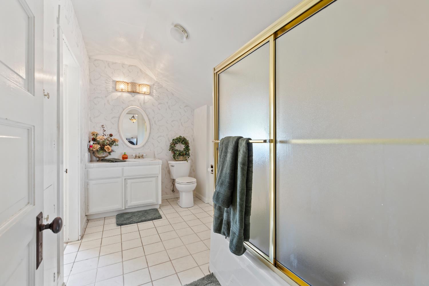 12407 Elm Avenue Patterson, CA 95363 - Photo 24 of 43 a room with a baby crib and a refrigerator