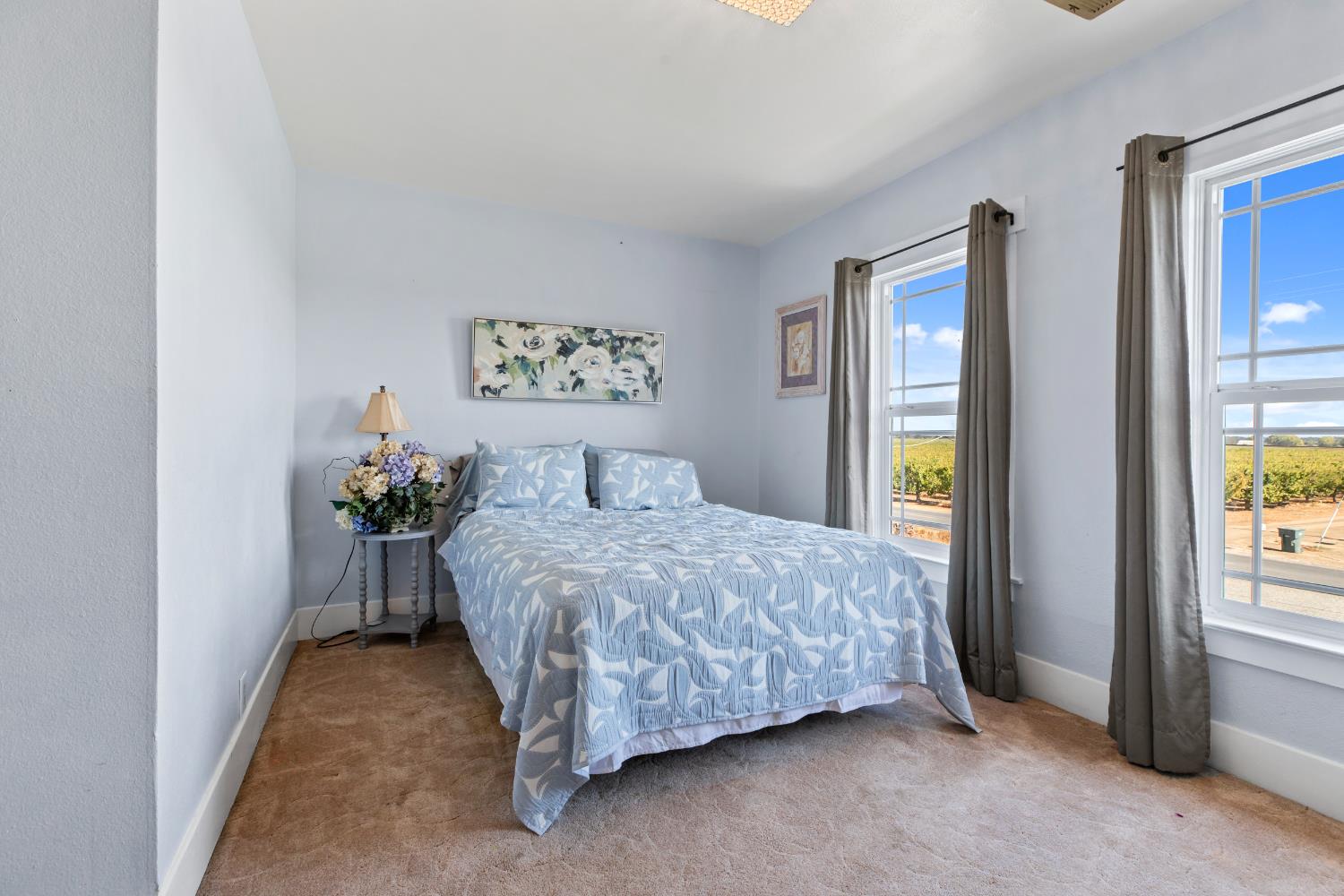 12407 Elm Avenue Patterson, CA 95363 - Photo 28 of 43 a bedroom with a bed and a window