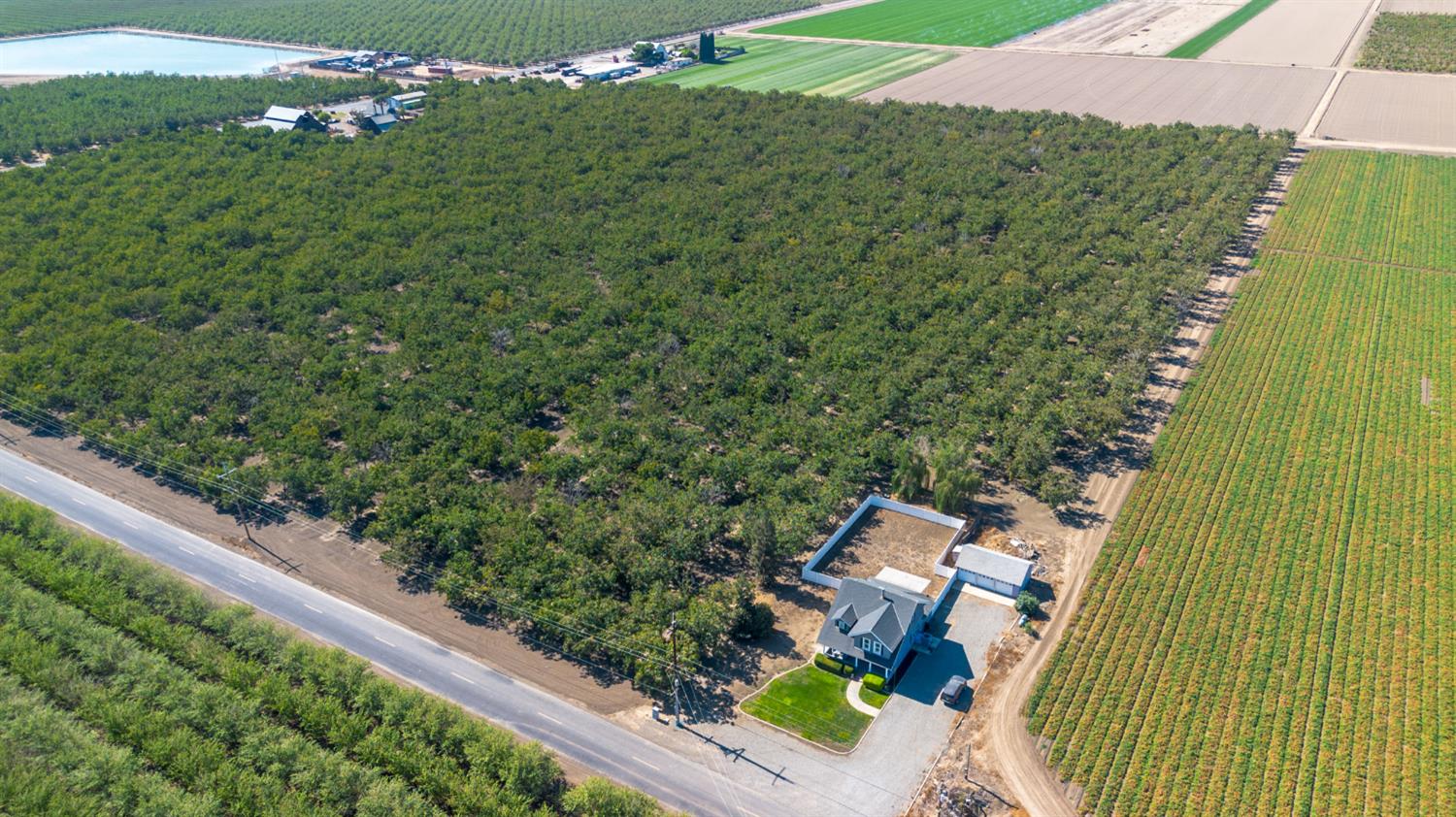 12407 Elm Avenue Patterson, CA 95363 - Photo 35 of 43 a view of a yard with potted plants