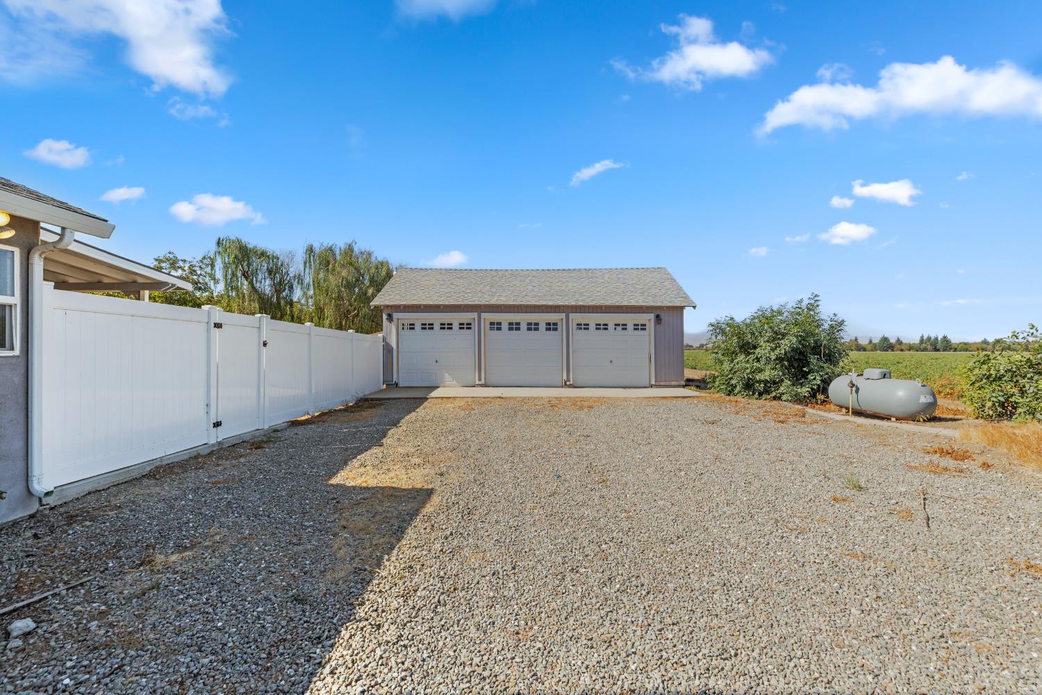 12407 Elm Avenue Patterson, CA 95363 - Photo 5 of 43 a front view of a house with a yard
