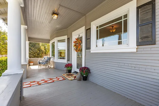 a backyard of a house with outdoor seating