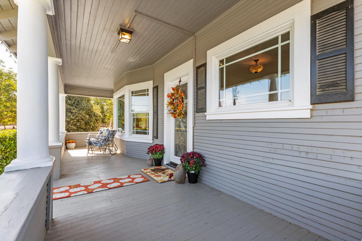 12407 Elm Avenue Patterson, CA 95363 - Photo 7 of 43 a backyard of a house with outdoor seating