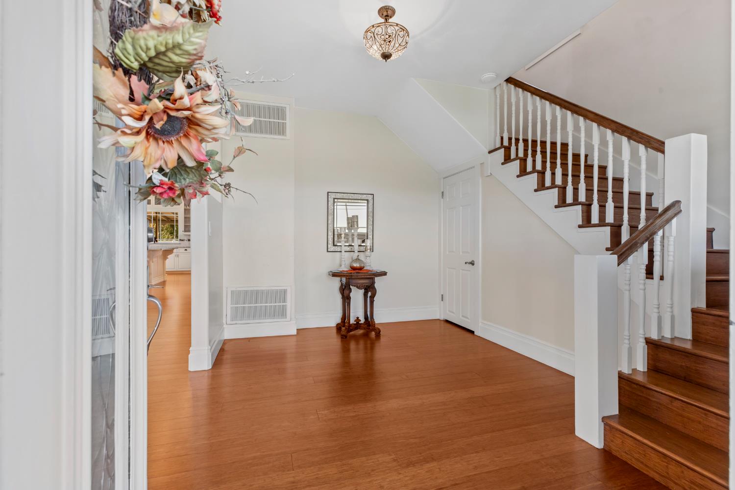 12407 Elm Avenue Patterson, CA 95363 - Photo 8 of 43 a view of entryway with a front door and wooden floor