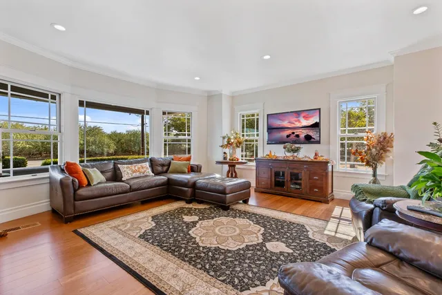 a living room with furniture windows and a fireplace