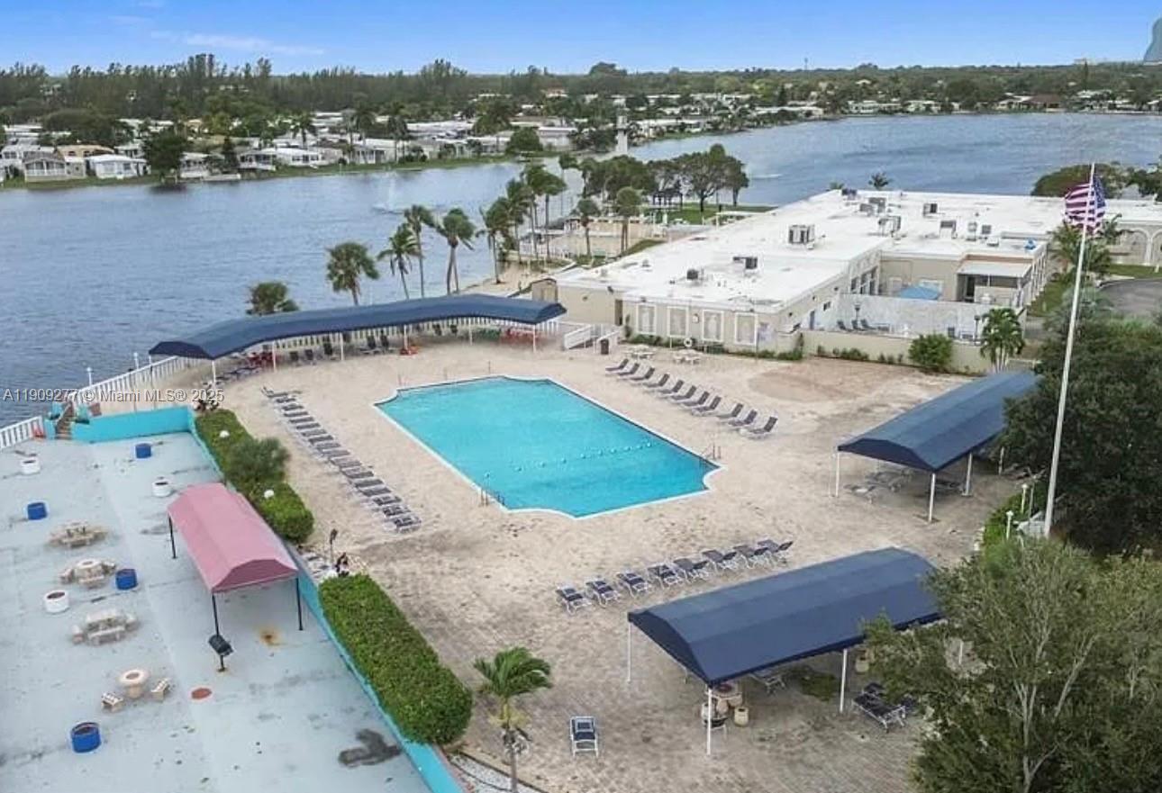 a view of a lake with couches and city view