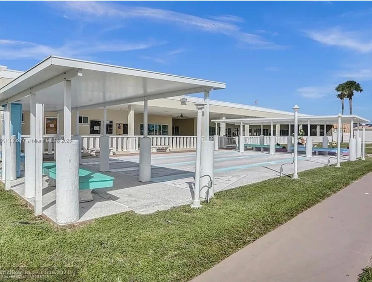 5470 Southwest 25th Way, Unit 5470 Dania Beach, FL 33312 - Photo 3 of 15 a view of a house with a yard porch and sitting area