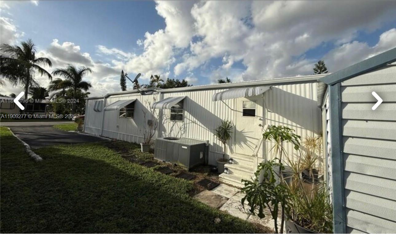 5470 Southwest 25th Way, Unit 5470 Dania Beach, FL 33312 - Photo 7 of 15 a view of a house with a yard